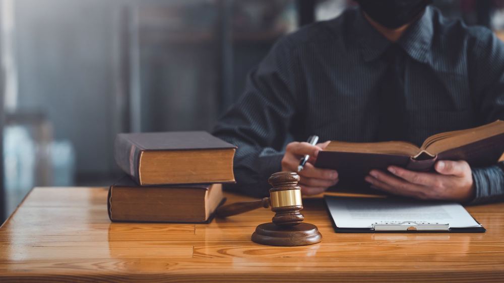 Lawyer reviewing papers at a desk